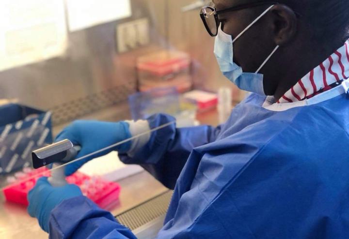 Woman working at a lab hood