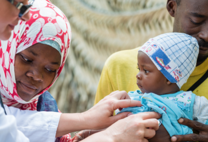 Doctor checking baby's breathing
