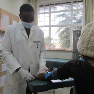 Clinician prepares to administer vaccine